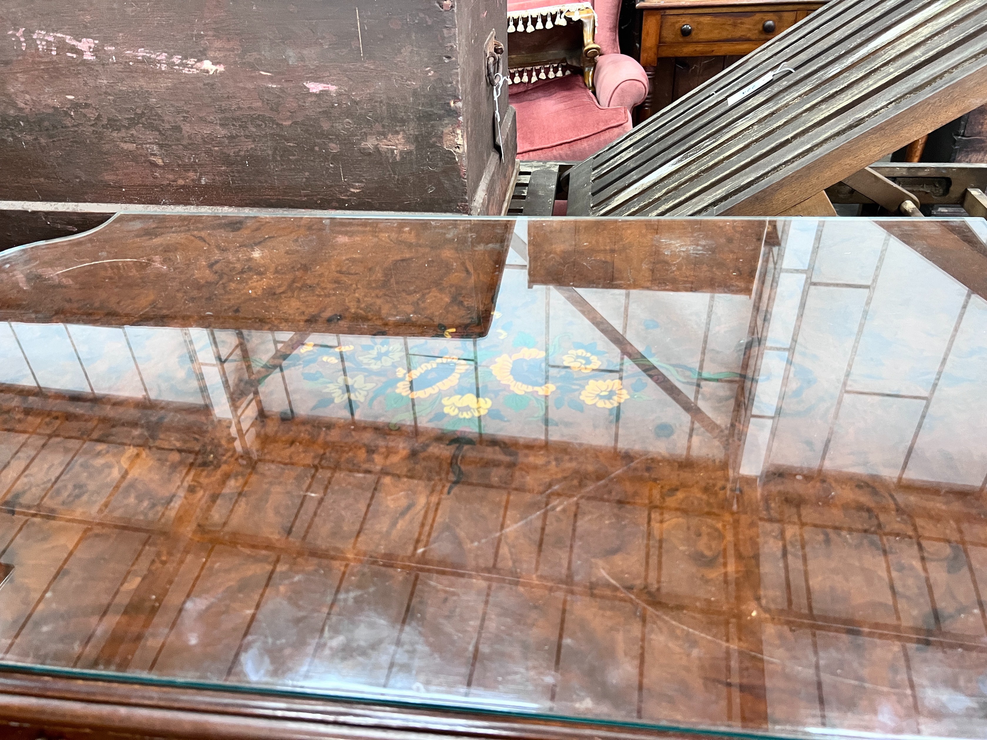 A continental marquetry inlaid walnut centre table, 117 x 59cm *Please note the sale commences at 9am.